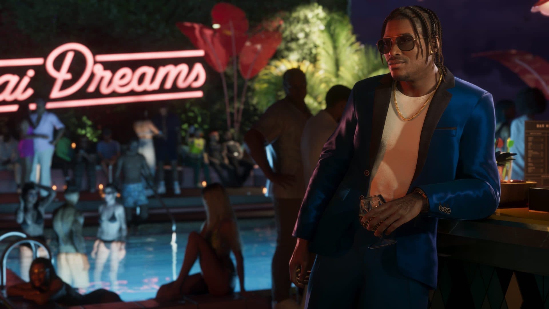 Dre'Quan Priest in a blue suit at a Vice City pool party
