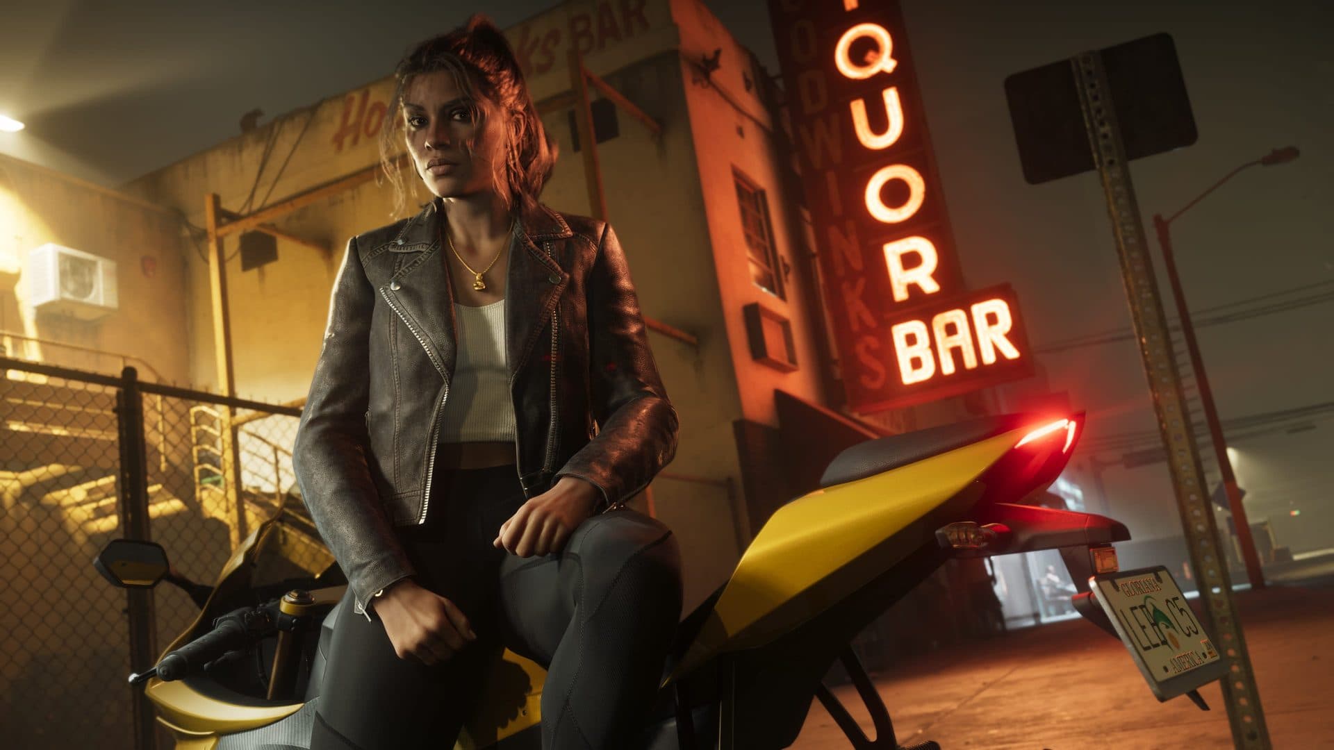 Lucia Caminos beside a motorcycle under a liquor bar sign at night