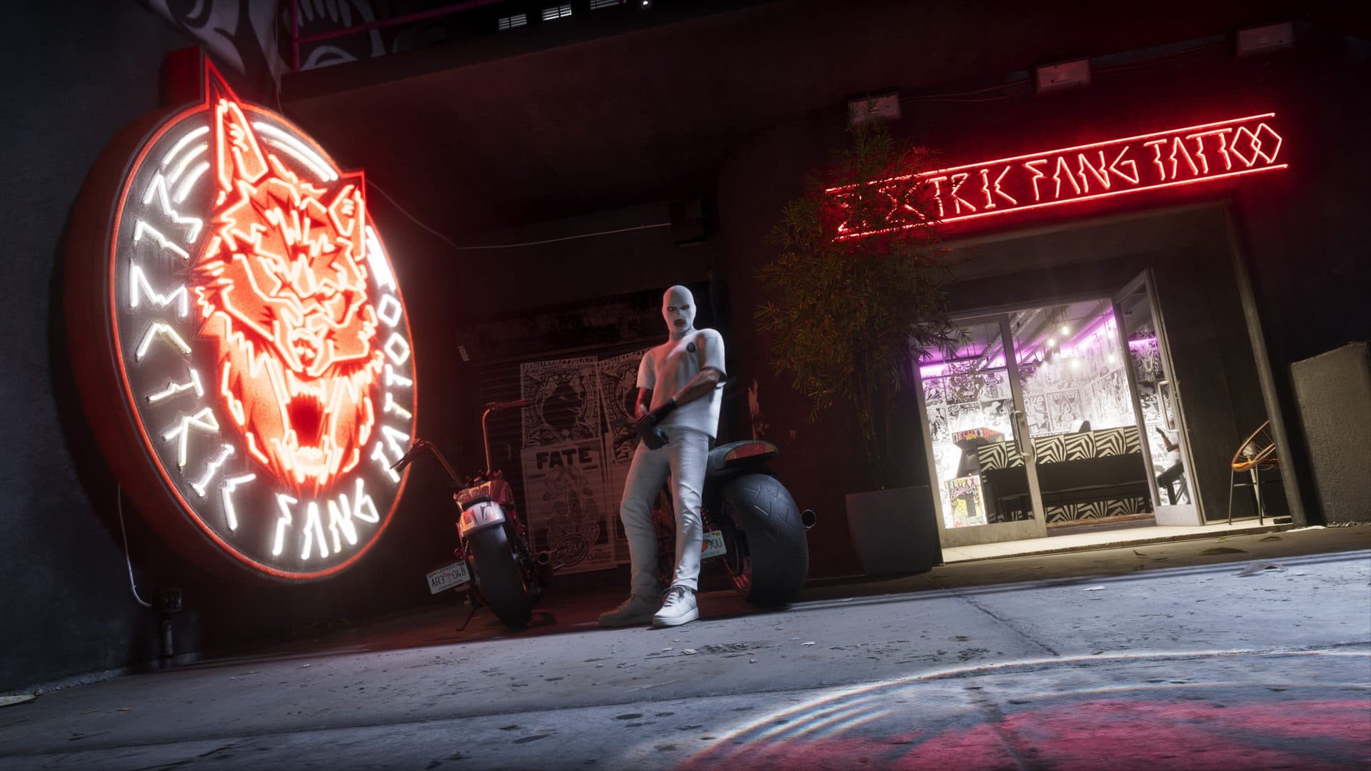The neon frontage of Electric Fang Tattoo at night