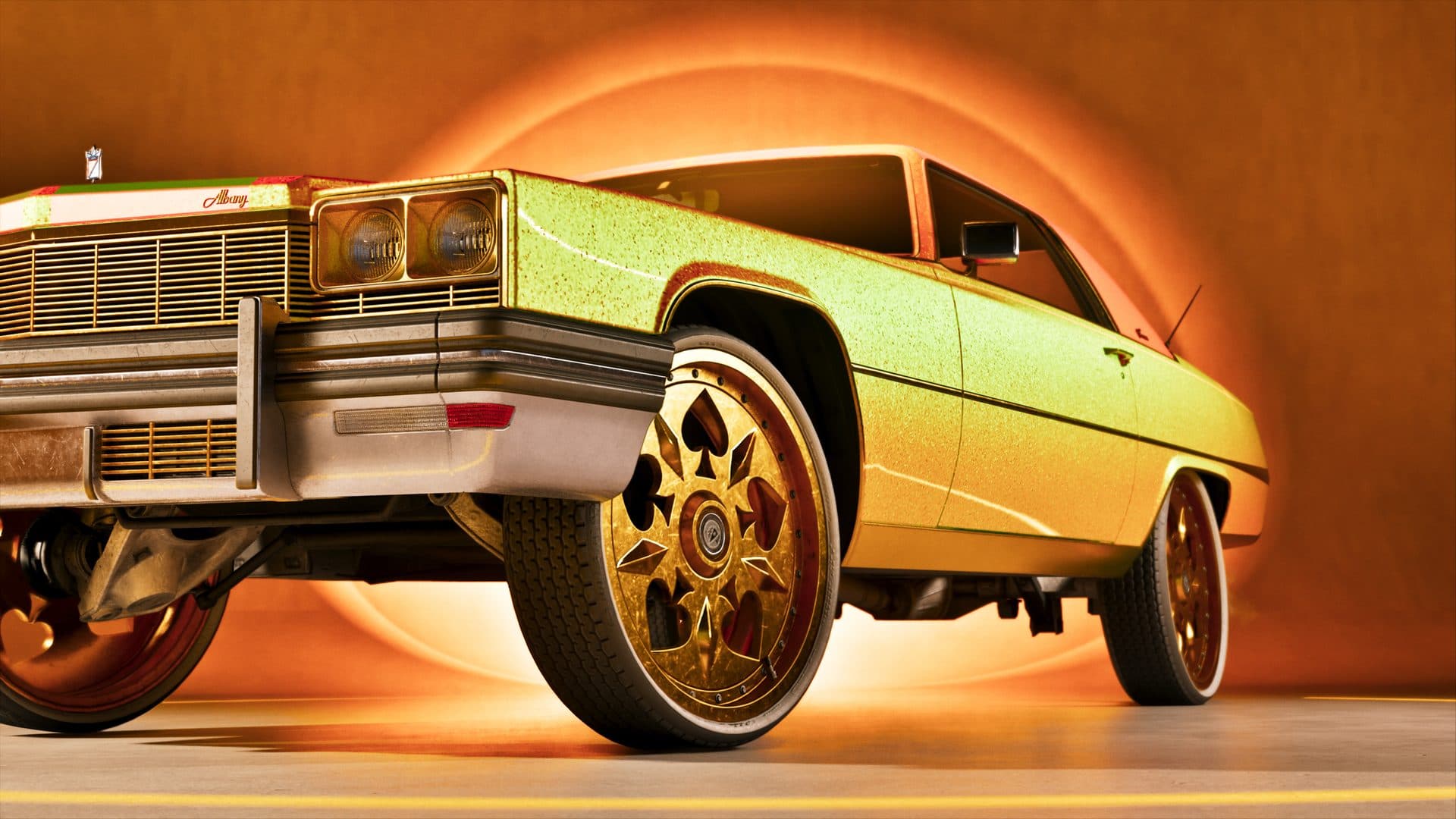 A gold lowrider on spoked wheels under studio lighting