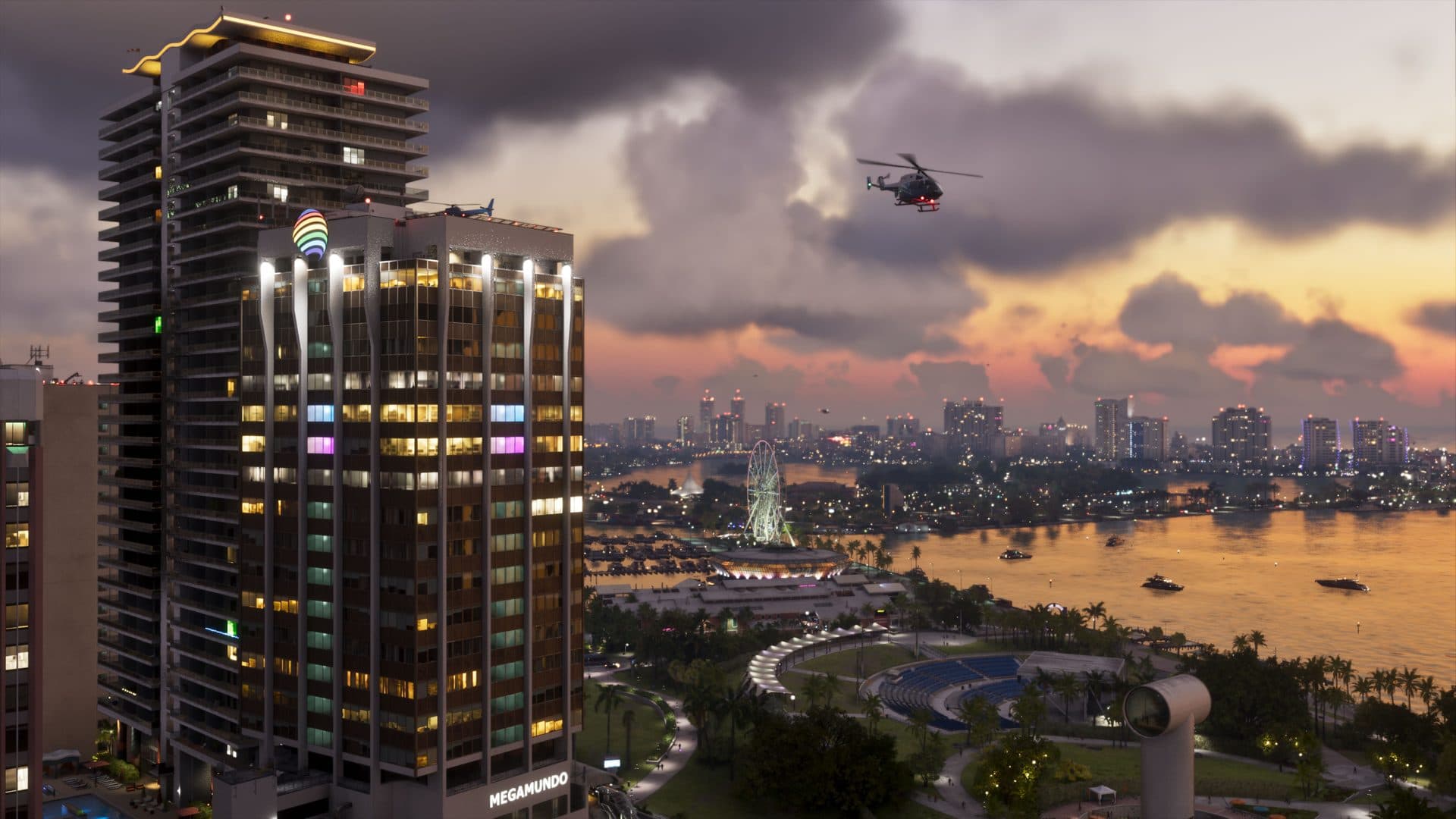 A lit Vice City tower at dusk with a helicopter overhead