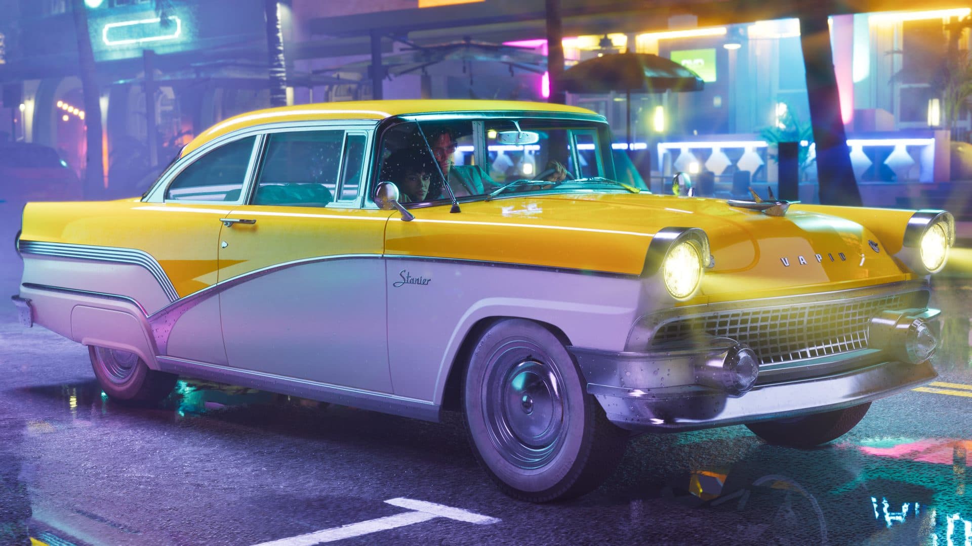 A yellow and white 1955 Vapid Stanier driving through Vice City at night