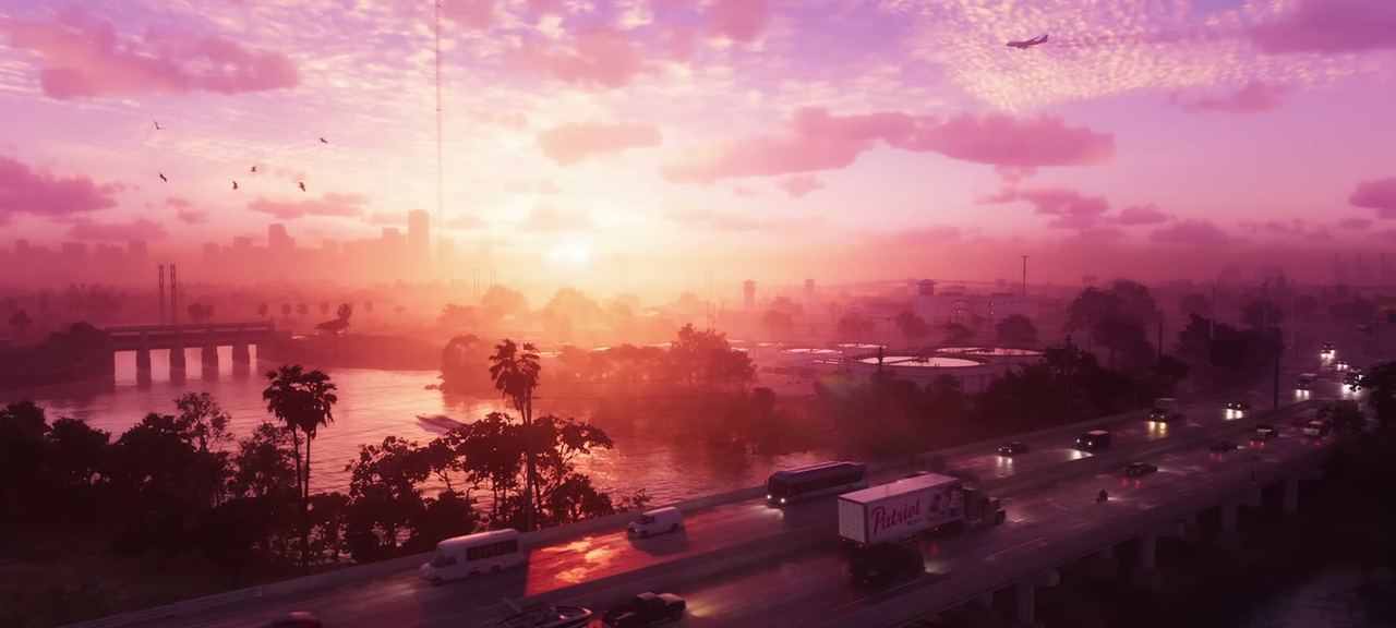Sunrise over a multi-lane highway, freight trucks running north. The first frame of the game anybody saw.