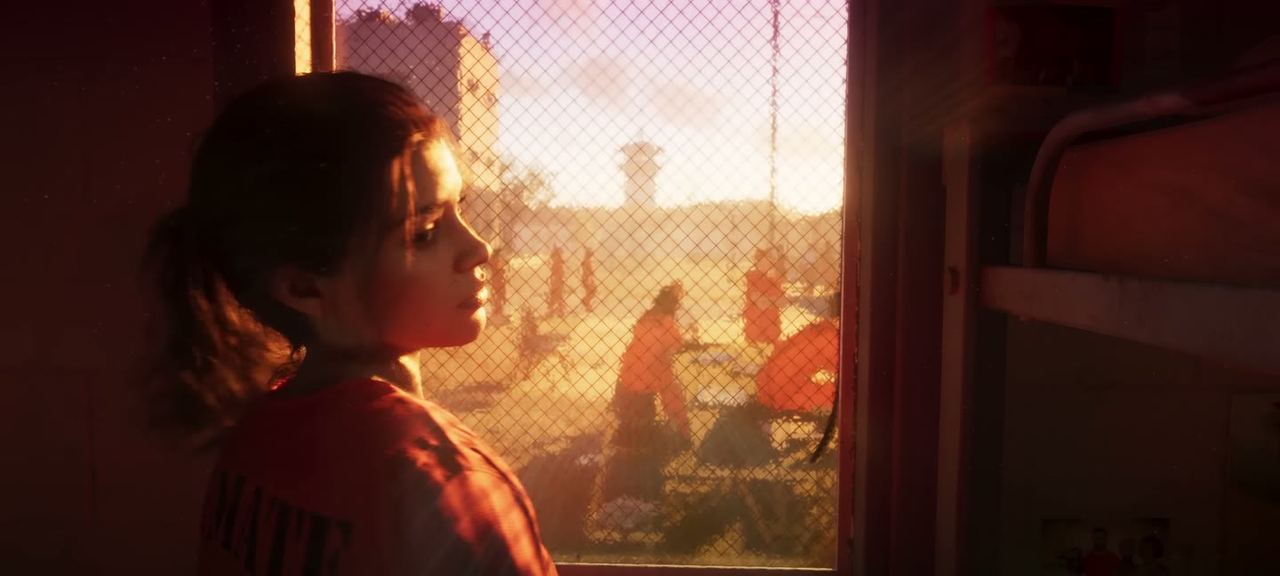 Lucia at a barred window in a transport vehicle, in custody.
