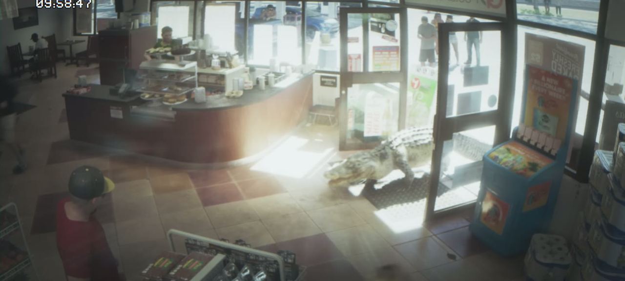 Security camera view of a store interior, timestamped in the corner.