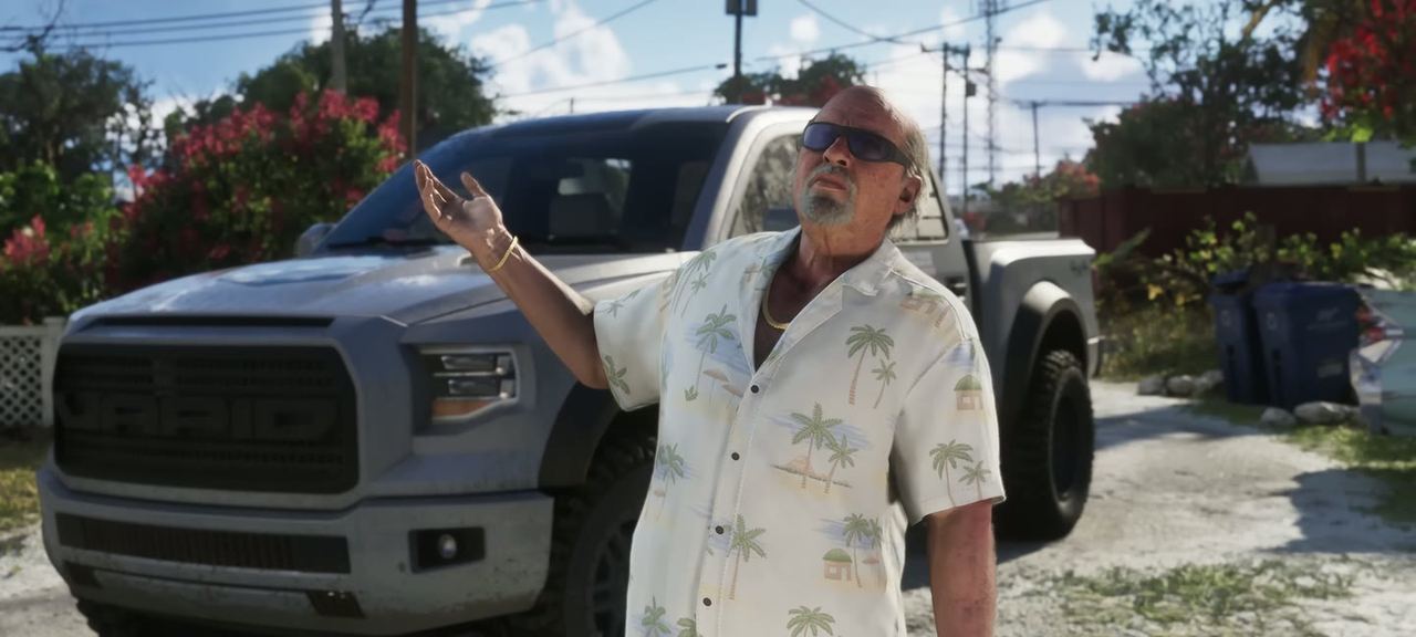 Brian Heder beside the white pick-up, arm raised.