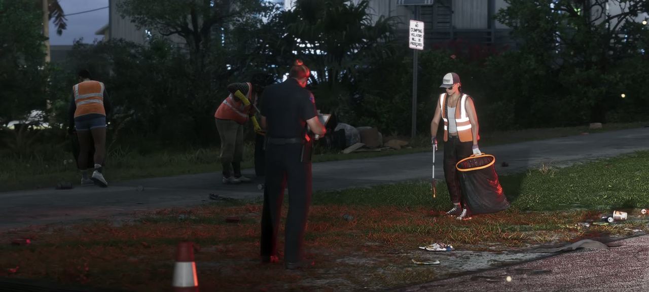 Roadside at night, workers and a cone, a vehicle stopped.