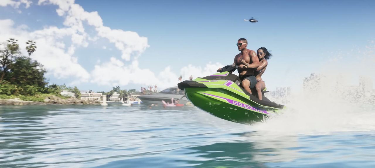 Two riders on a jet ski out on open water.