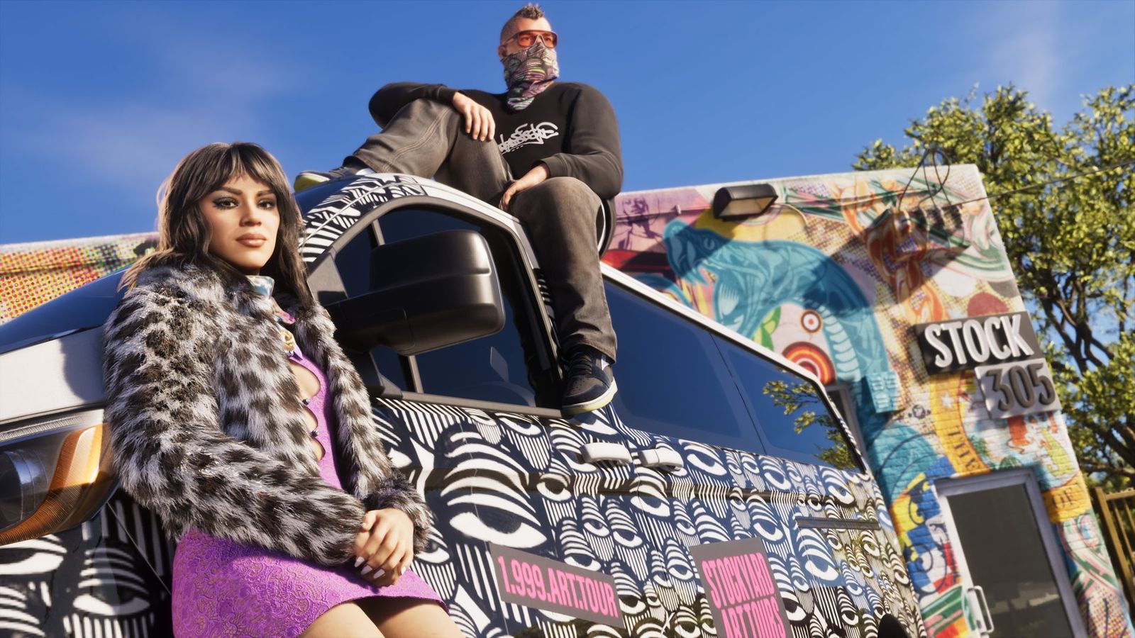 Two people sitting on the open tailgate of a van covered in stickers and painted lettering